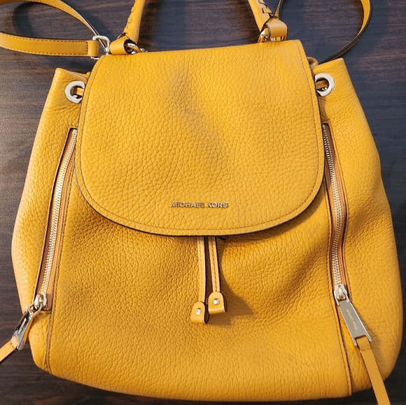 Michael Kors Handbags - Michael Kors Cinch Backpack Yellow - Gently Used